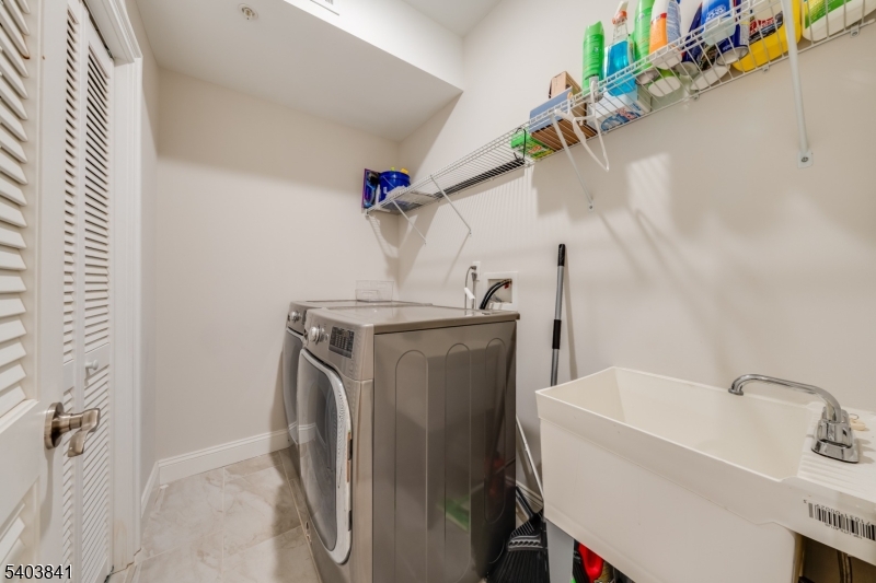 231 River Road, Unit 231 Somerville, NJ 08876 - Photo 28 of 31 a utility room with dryer and washer