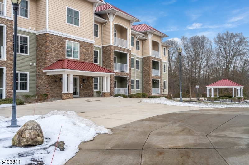 231 River Road, Unit 231 Somerville, NJ 08876 - Photo 29 of 31 a view of a building with a yard