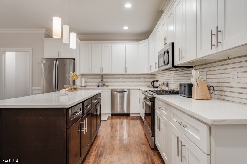 231 River Road, Unit 231 Somerville, NJ 08876 - Photo 6 of 31 a kitchen with stainless steel appliances granite countertop a sink stove and refrigerator