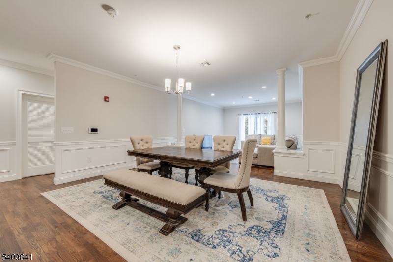 231 River Road, Unit 231 Somerville, NJ 08876 - Photo 10 of 31 a living room with dining room and wooden floor
