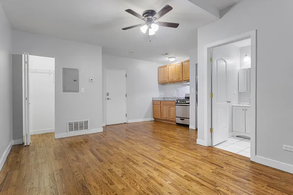 a view of a kitchen with a sink and cabinet area
