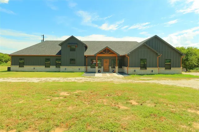 a front view of a house with swimming pool
