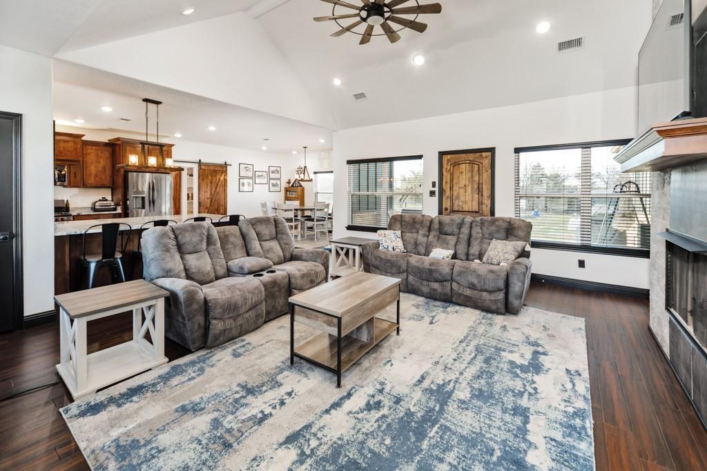 217 Polk Road Bowie, TX 76230 - Photo 11 of 39 a living room with furniture and a fireplace