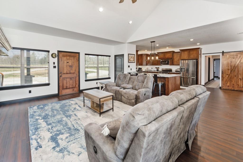 217 Polk Road Bowie, TX 76230 - Photo 12 of 39 a living room with furniture and a large window