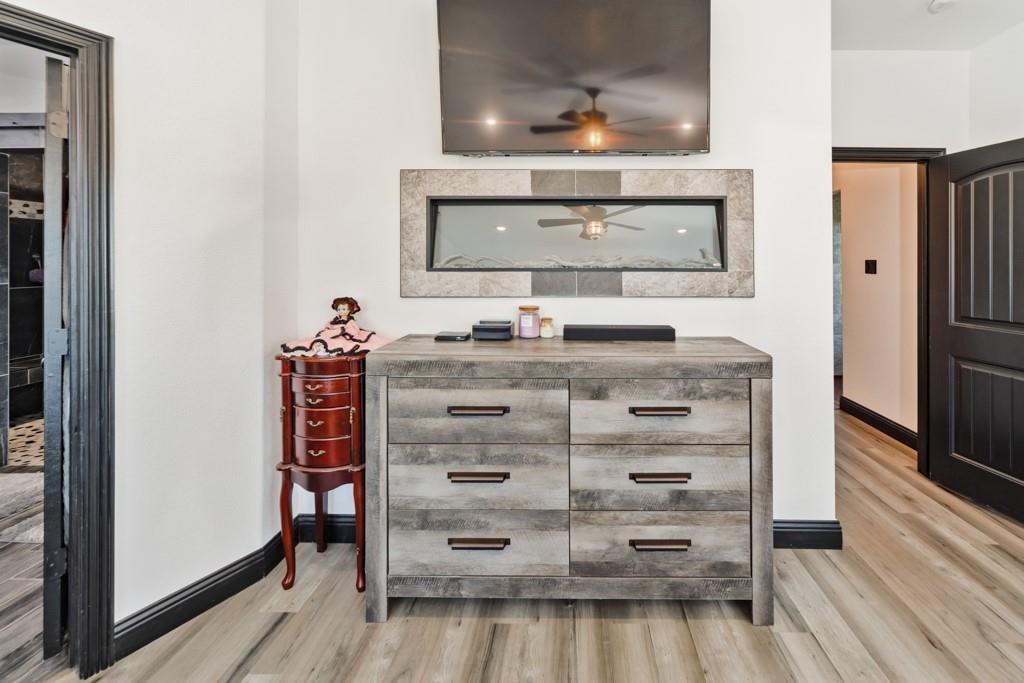 217 Polk Road Bowie, TX 76230 - Photo 15 of 39 a view of dresser with wooden floor