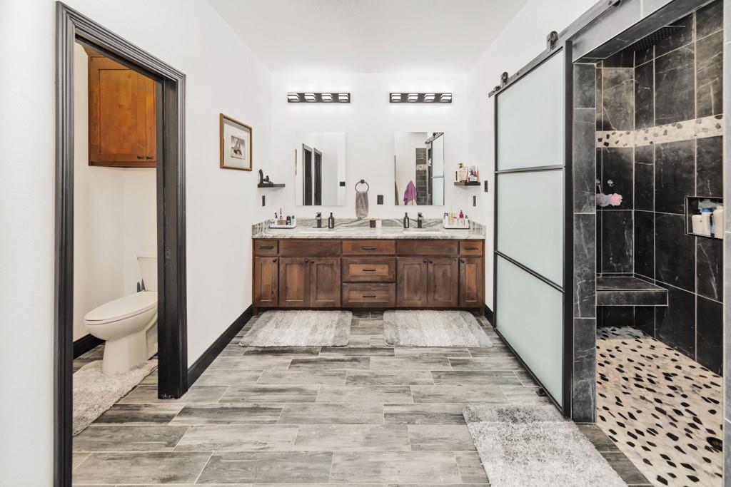 217 Polk Road Bowie, TX 76230 - Photo 16 of 39 a large bathroom with a tub and shower