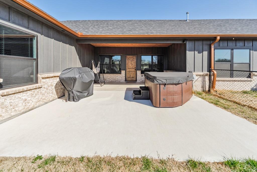 217 Polk Road Bowie, TX 76230 - Photo 30 of 39 a view of a patio with dining table and chairs