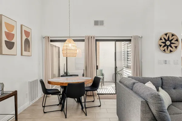 a view of a dining room with furniture window and outside view