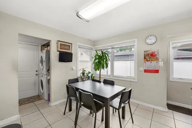 a view of a dining room that has a table and chairs in it