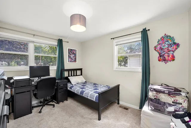 a workspace with furniture and a window