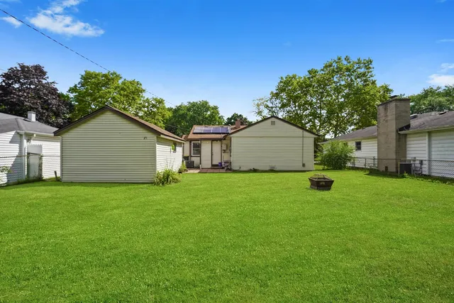 a house view with a backyard space
