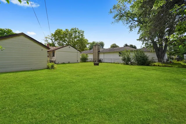 a view of a backyard of the house