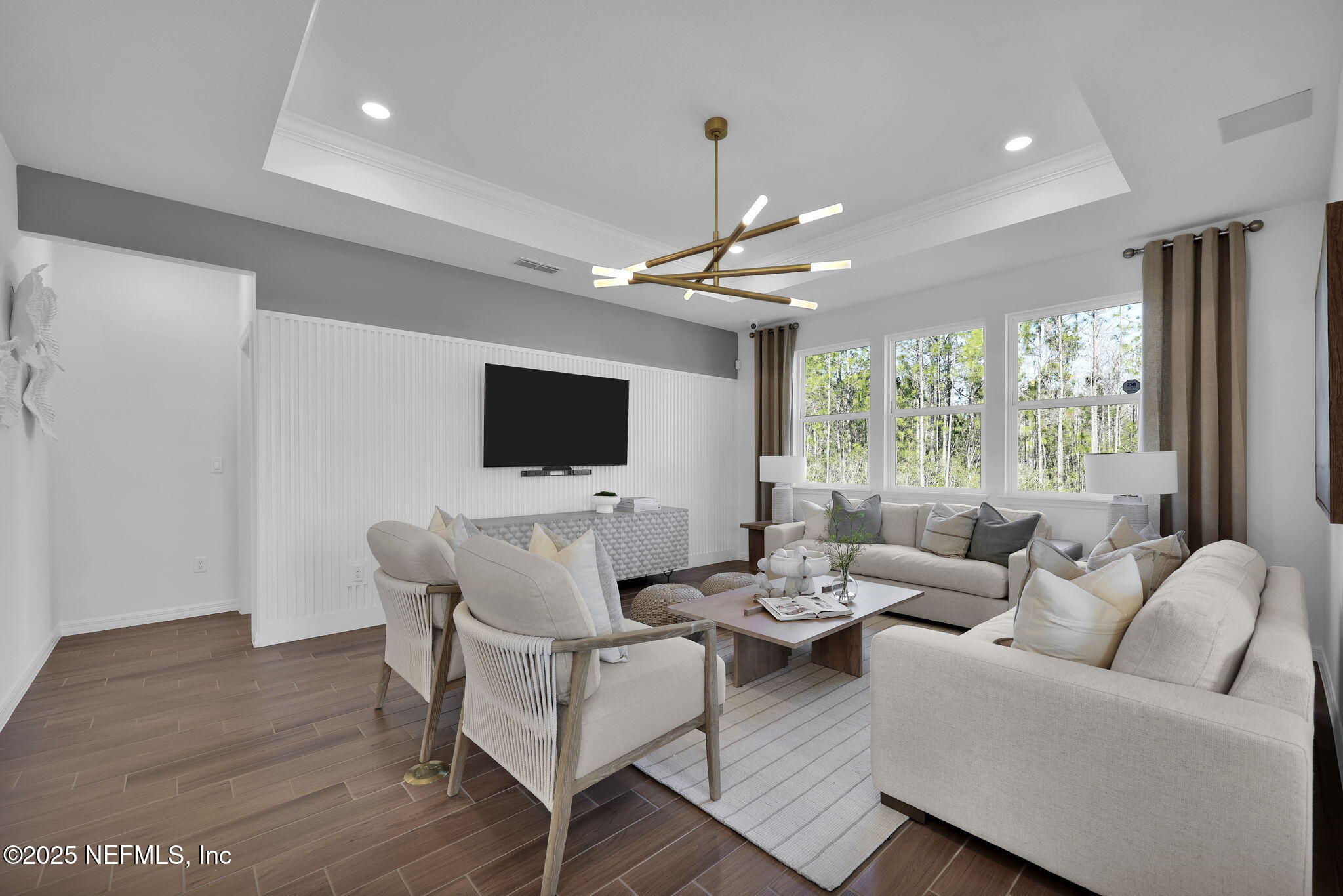 1745 Mickey Way Middleburg, FL 32068 - Photo 18 of 30 a living room with furniture wooden floor and a flat screen tv