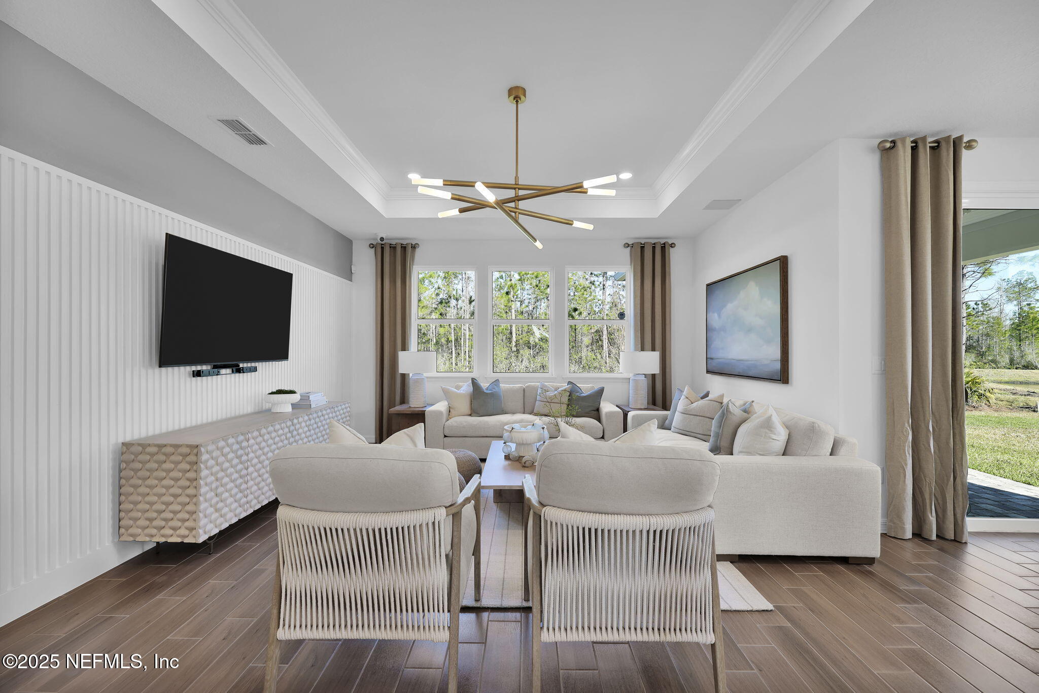 1745 Mickey Way Middleburg, FL 32068 - Photo 19 of 30 a living room with furniture and a flat screen tv