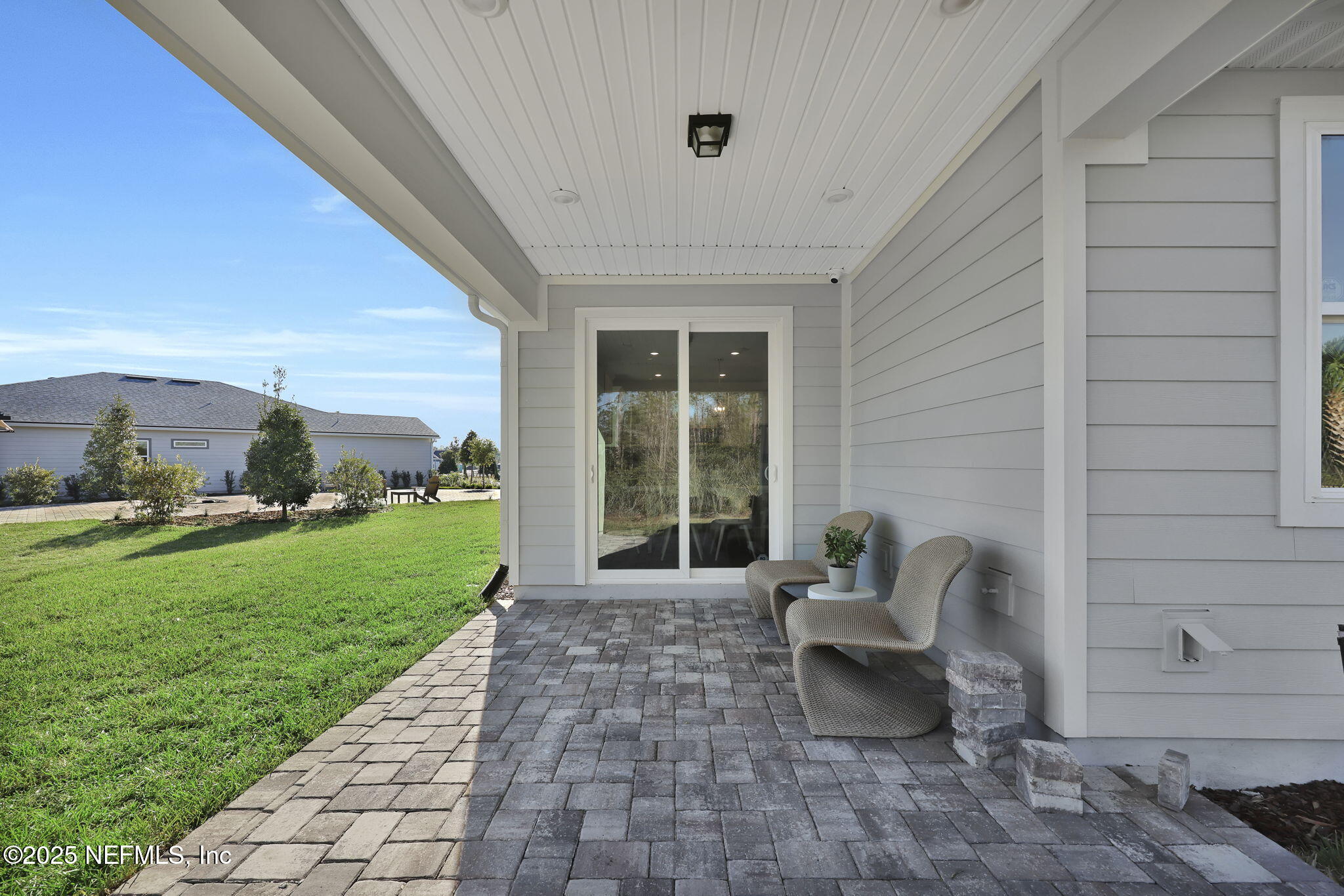 1745 Mickey Way Middleburg, FL 32068 - Photo 28 of 30 a view of a patio with a table and chairs and a barbeque