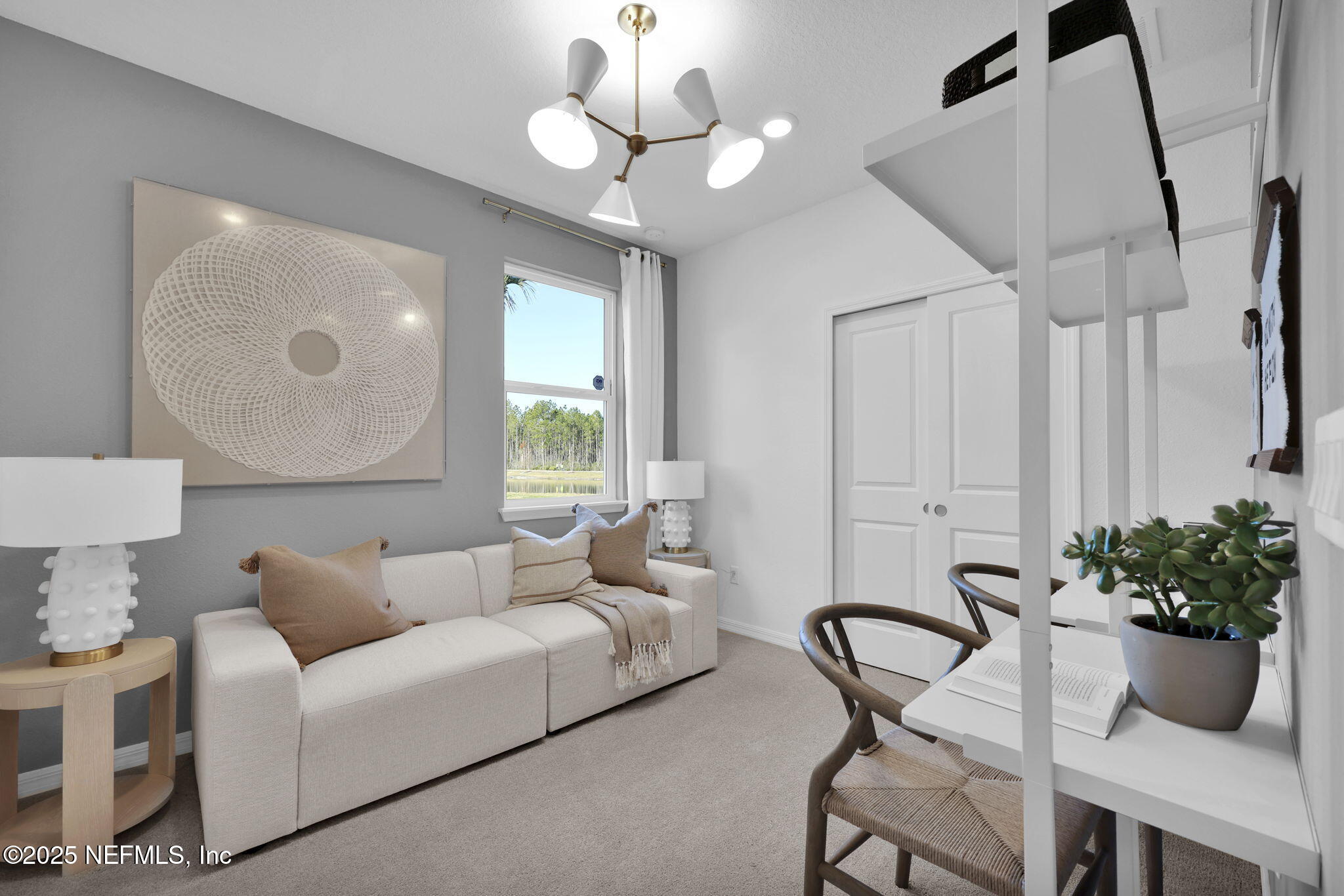 1745 Mickey Way Middleburg, FL 32068 - Photo 29 of 30 a living room with furniture potted plant and a chandelier