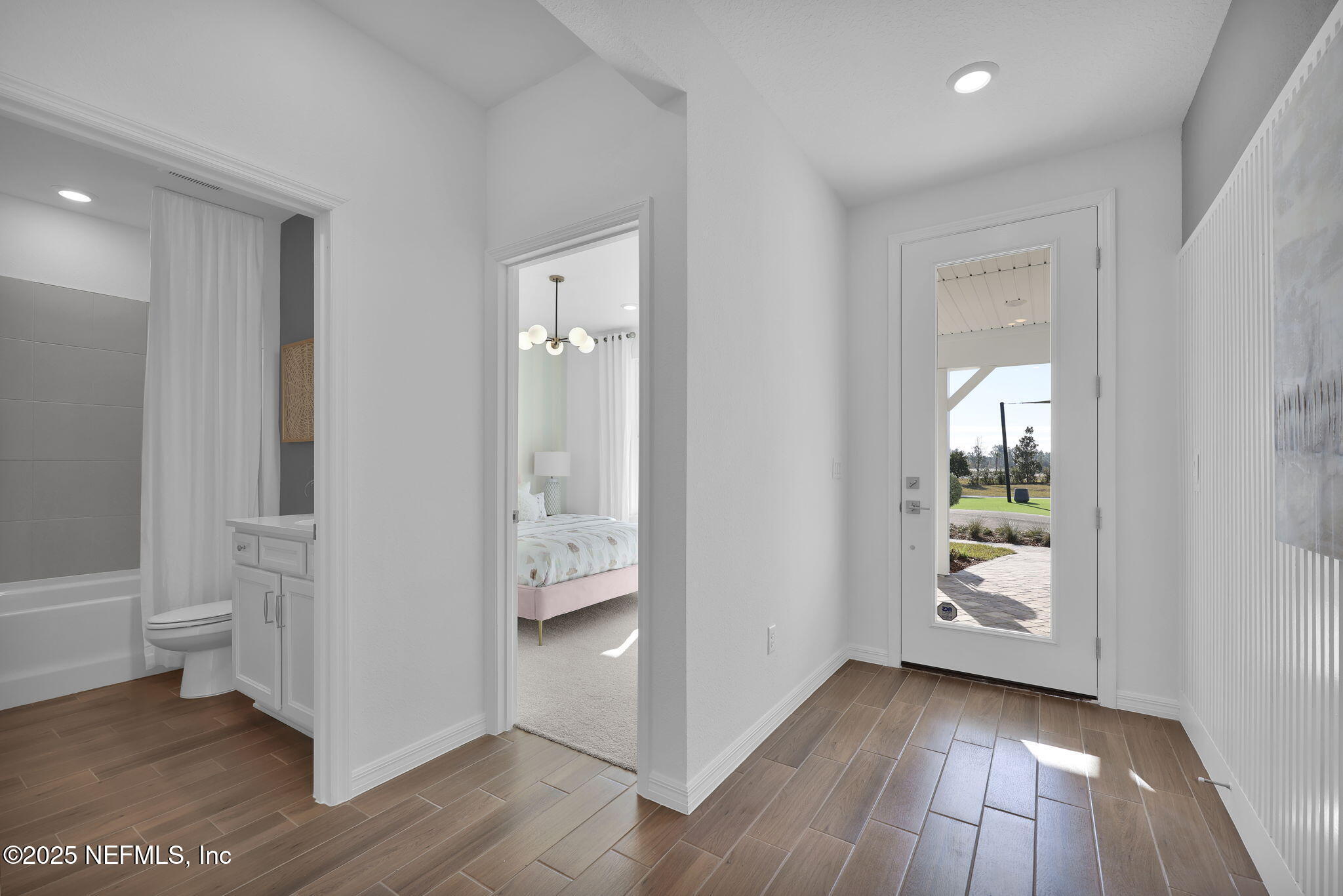 1745 Mickey Way Middleburg, FL 32068 - Photo 5 of 30 a view of an empty room and wooden floor