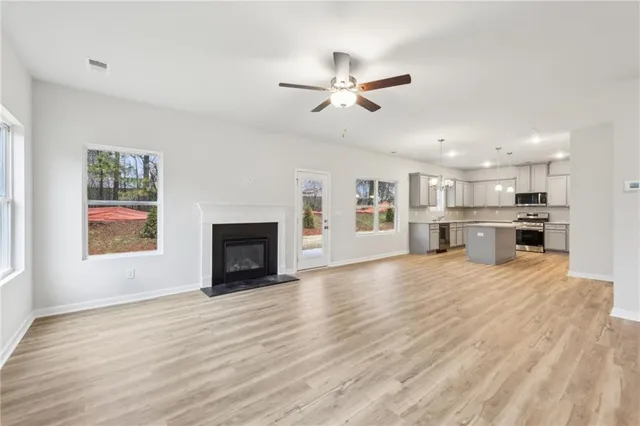 a view of a kitchen with a stove cabinets and wooden floor