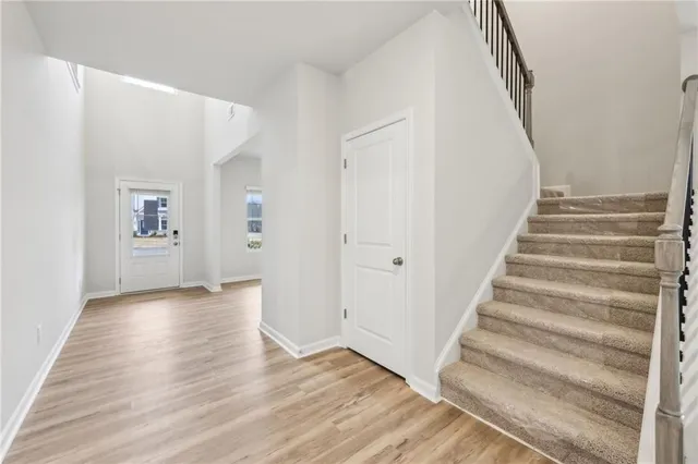 a view of an entryway with wooden floor