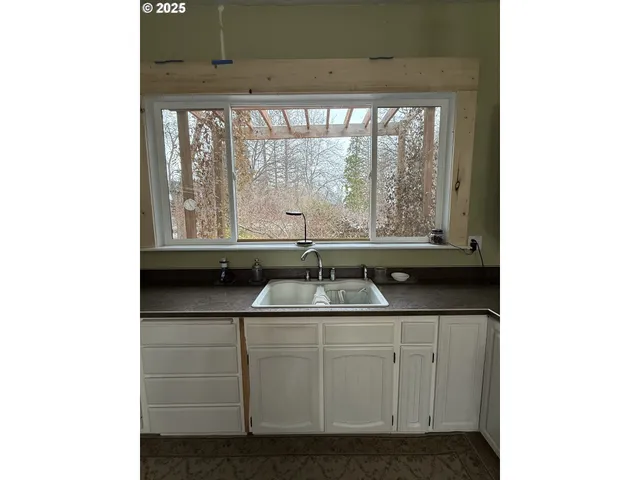 a kitchen with a sink and a window