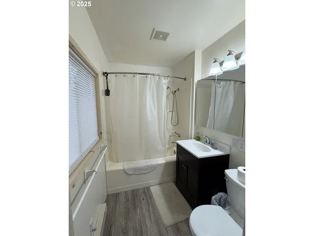 a bathroom with a sink toilet tub and shower