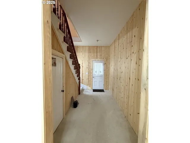 a view of a hallway with staircase