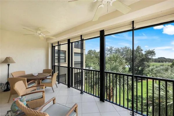 a balcony with chairs