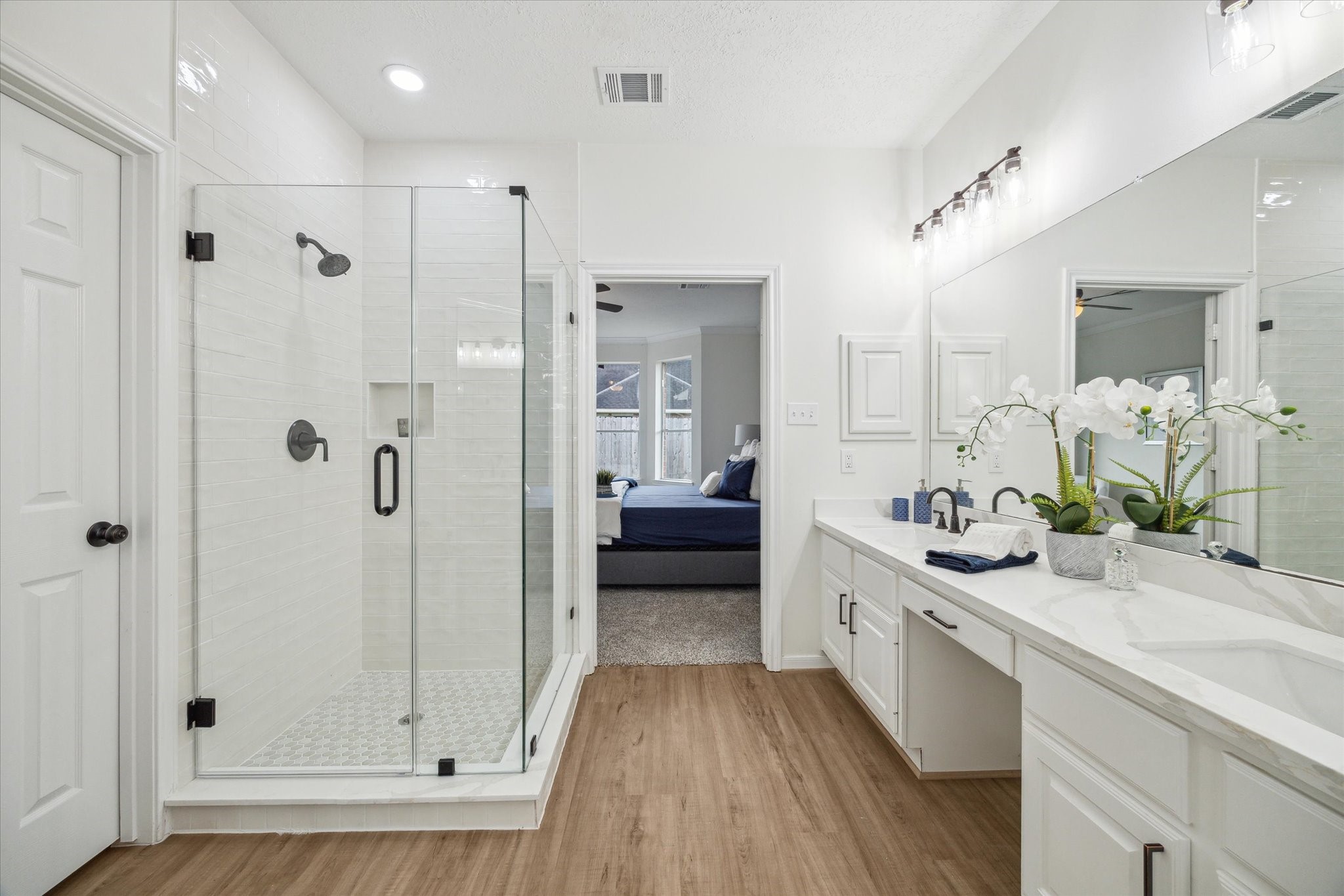 25403 Myrtle Springs Spring, TX 77373 - Photo 11 of 16 a bathroom with a double vanity sink a mirror a shower and a bathtub