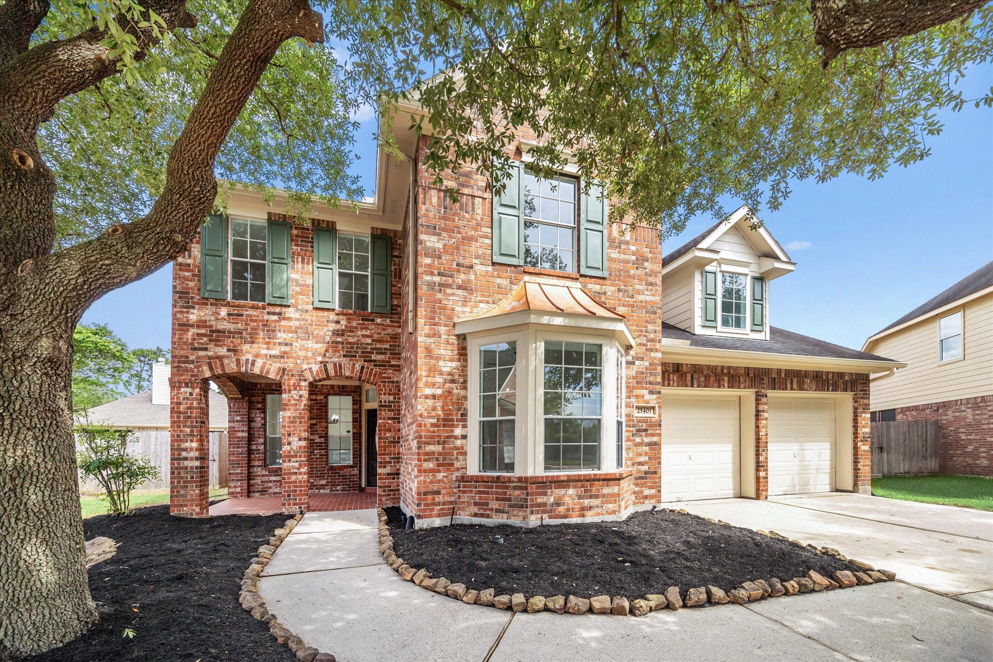 25403 Myrtle Springs Spring, TX 77373 - Photo 2 of 16 front view of a house with a yard