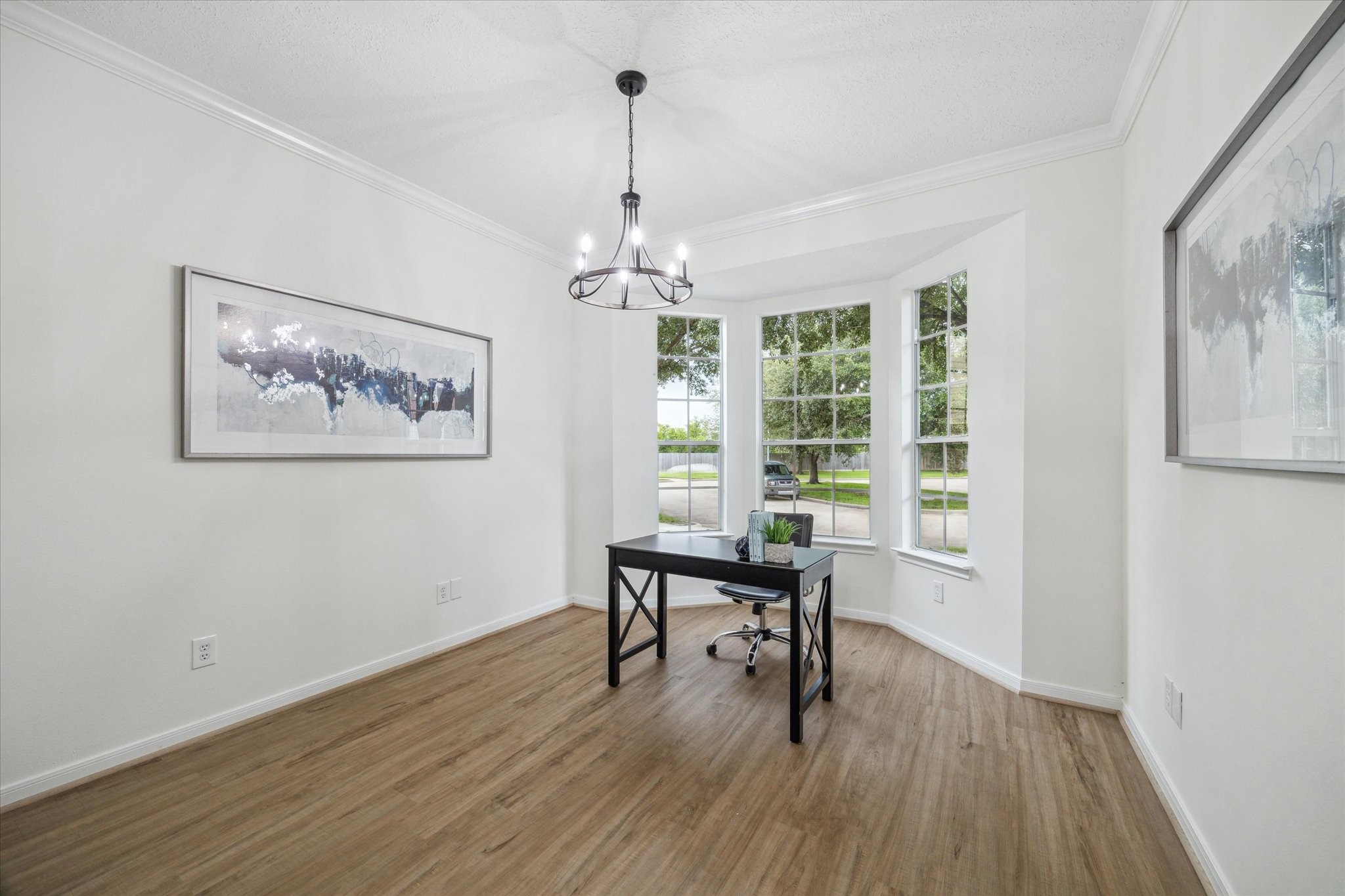 25403 Myrtle Springs Spring, TX 77373 - Photo 3 of 16 a dining room with wooden floor a chandelier a glass table and windows