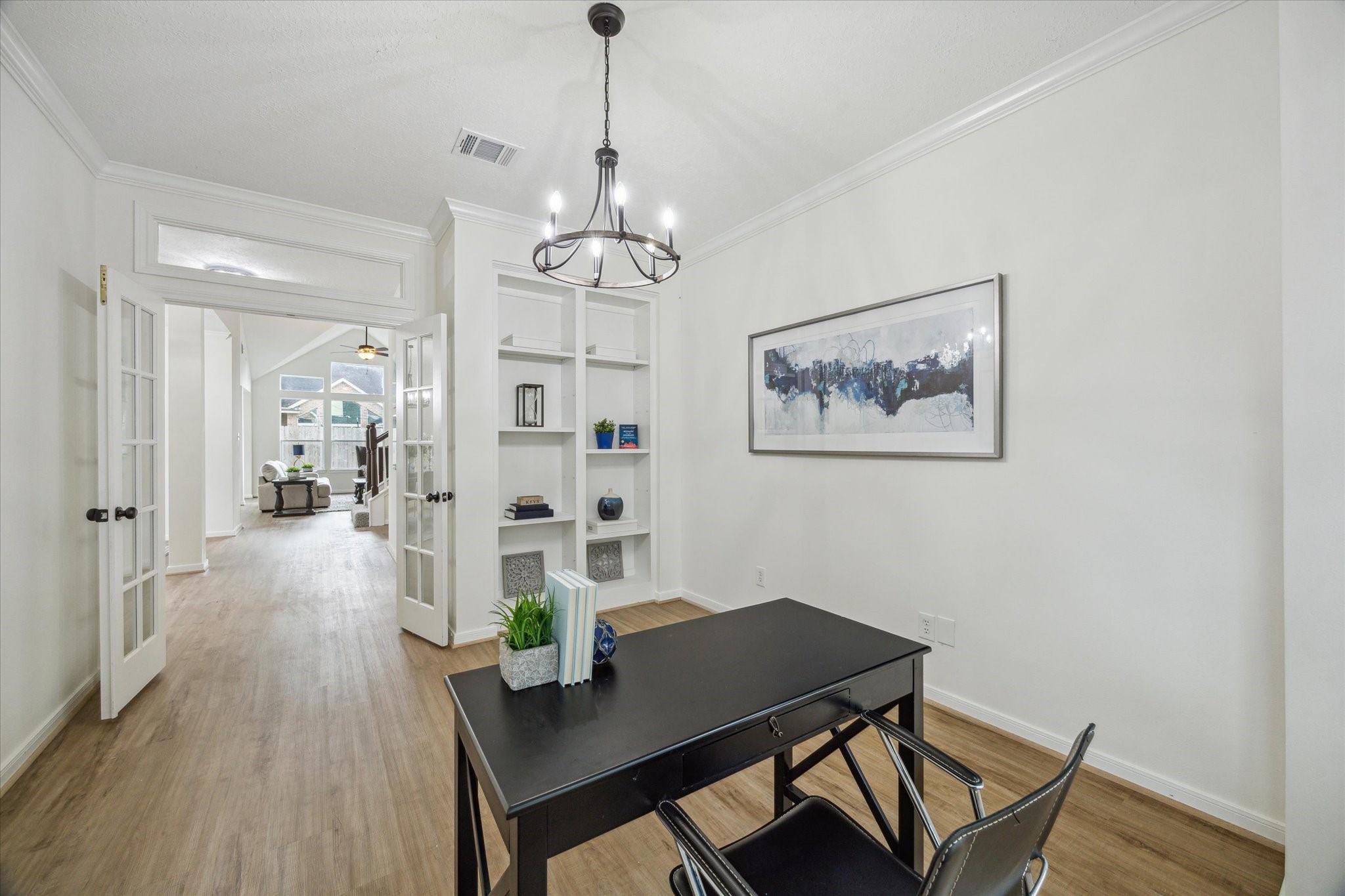 25403 Myrtle Springs Spring, TX 77373 - Photo 4 of 16 a view of a dining room with furniture wooden floor and a chandelier