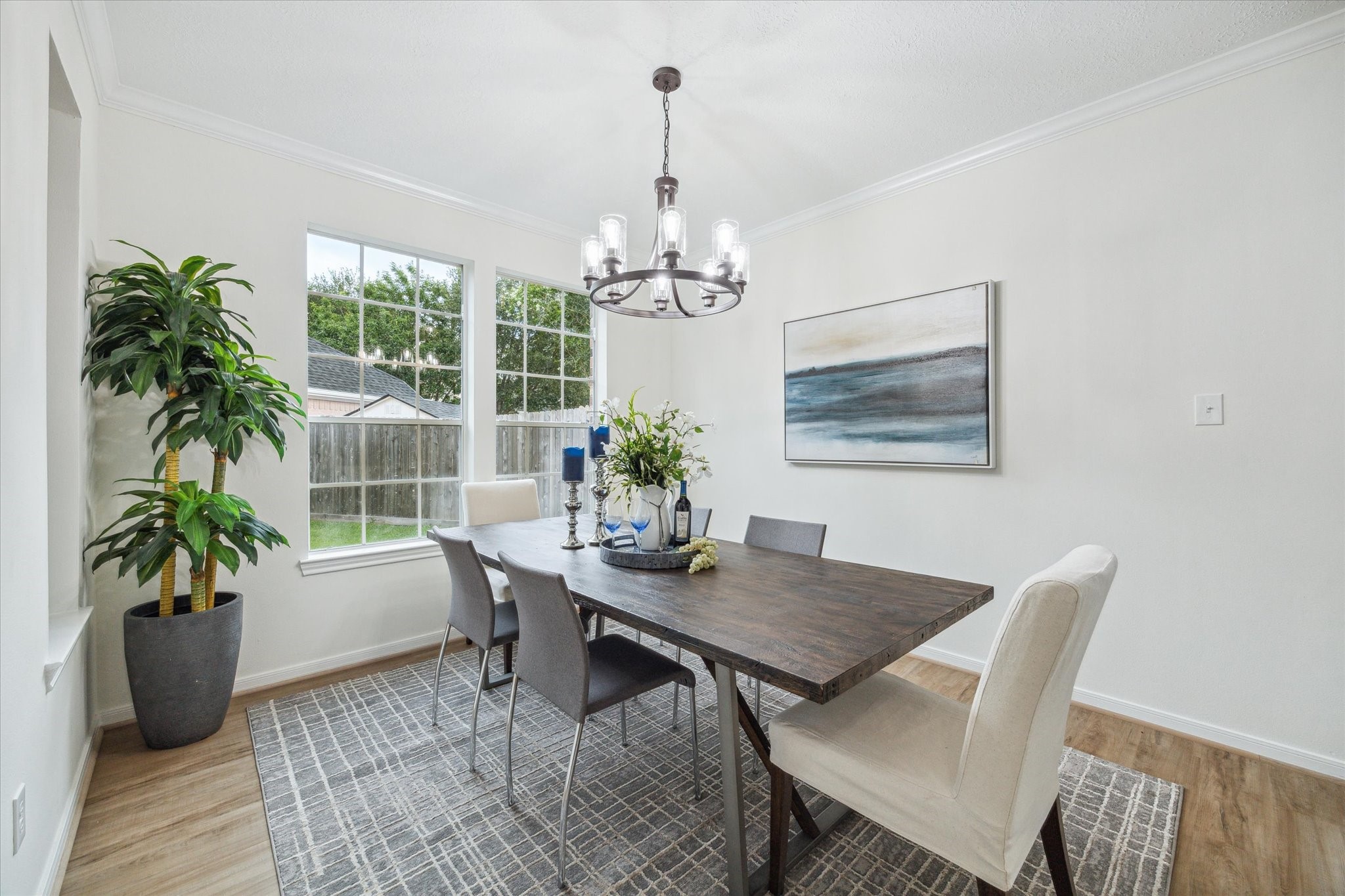 25403 Myrtle Springs Spring, TX 77373 - Photo 5 of 16 a dining room with furniture potted plants and wooden floor