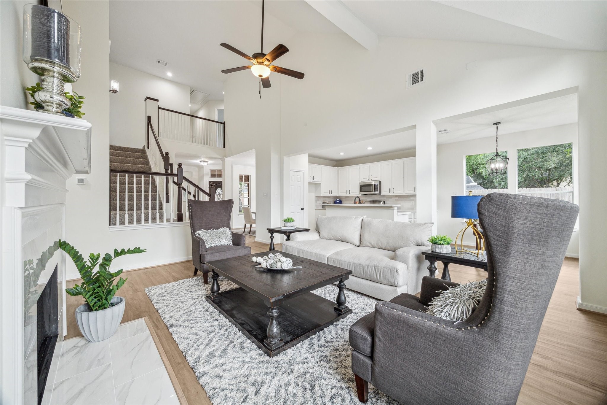 25403 Myrtle Springs Spring, TX 77373 - Photo 6 of 16 a living room with furniture fireplace and a chandelier