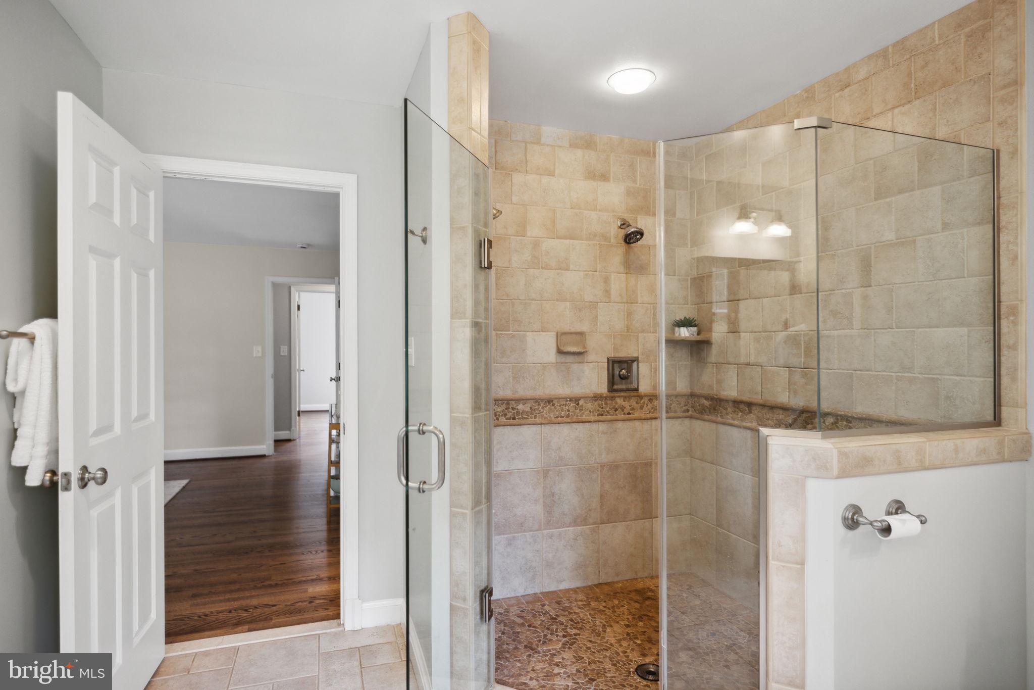 8012 Beech Tree Road Bethesda, MD 20817 - Photo 12 of 25 a bathroom with a shower and a sink