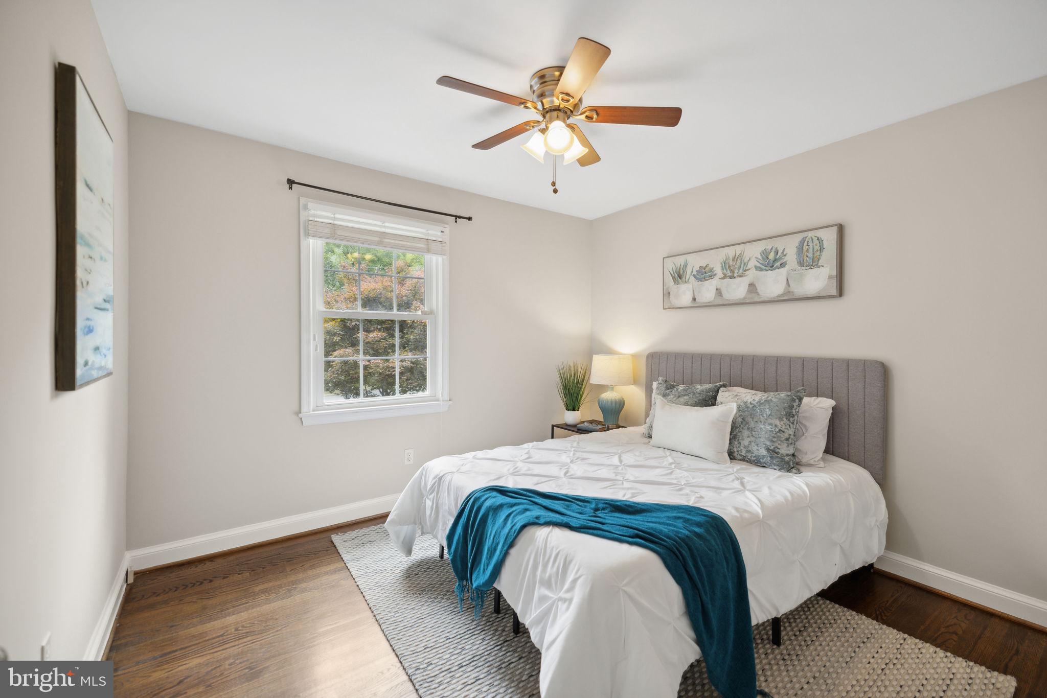 8012 Beech Tree Road Bethesda, MD 20817 - Photo 13 of 25 a bedroom with a bed and window
