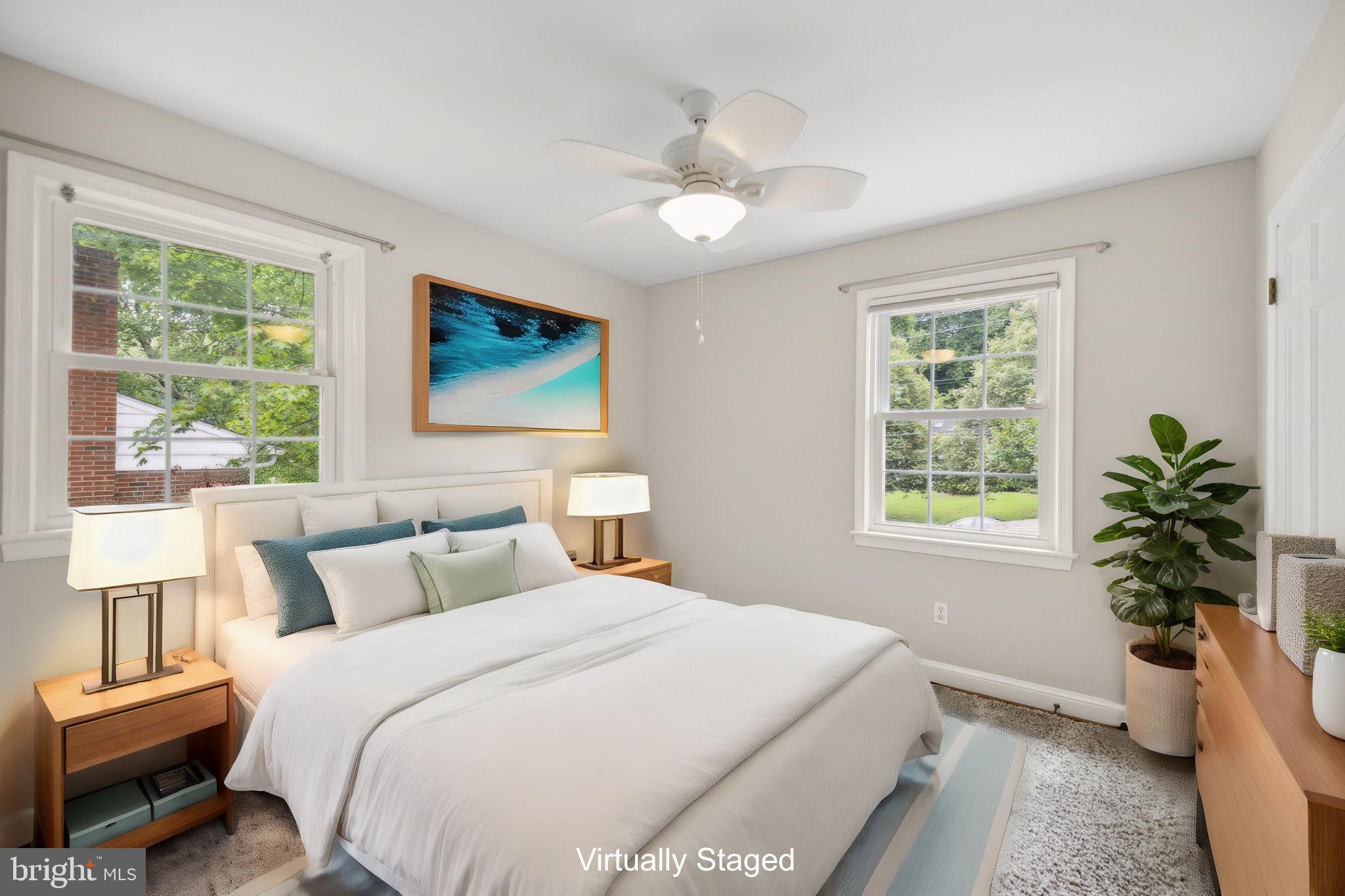 8012 Beech Tree Road Bethesda, MD 20817 - Photo 14 of 25 a bedroom with a large bed and a window