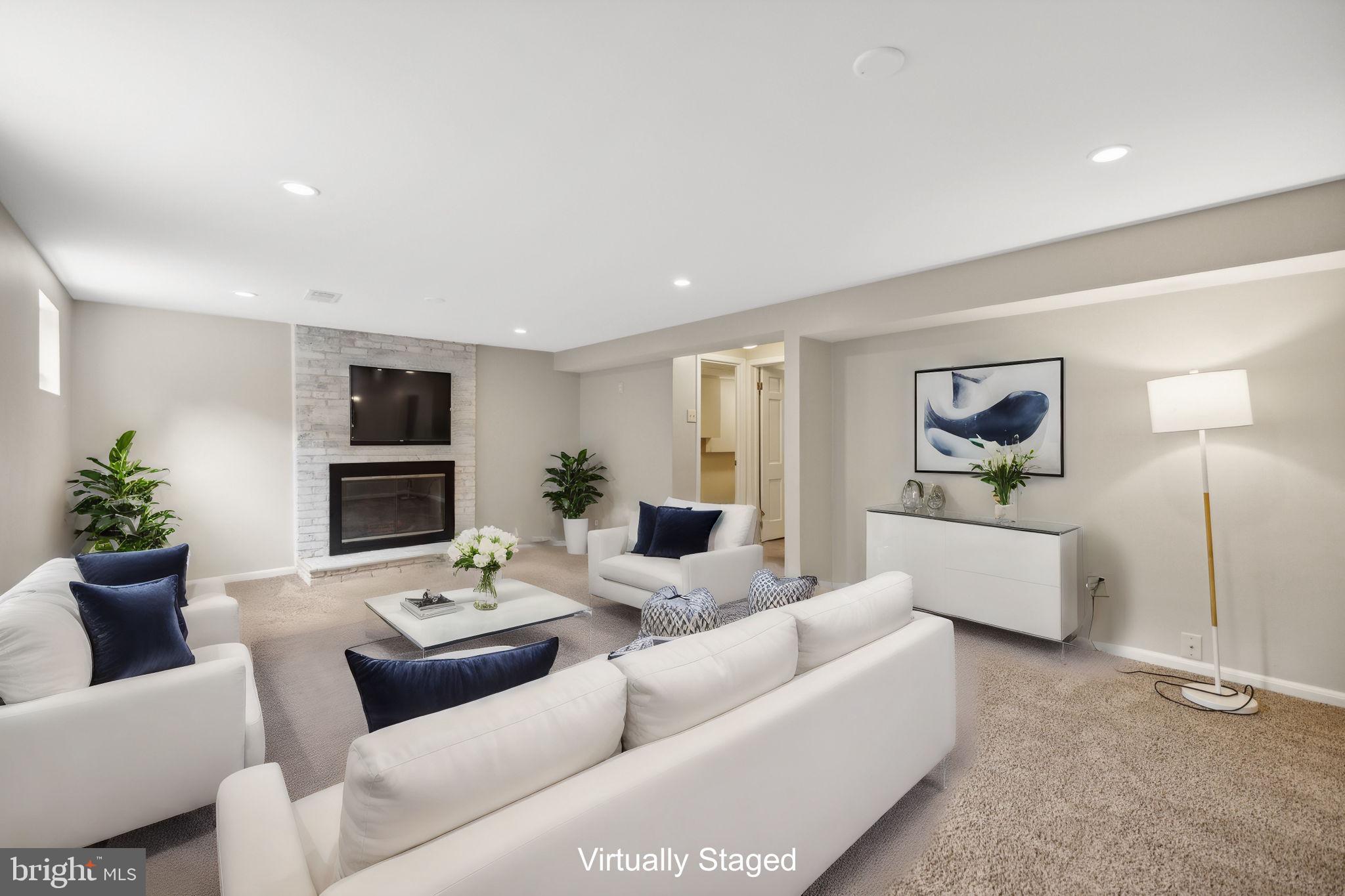 8012 Beech Tree Road Bethesda, MD 20817 - Photo 16 of 25 a living room with furniture and a flat screen tv
