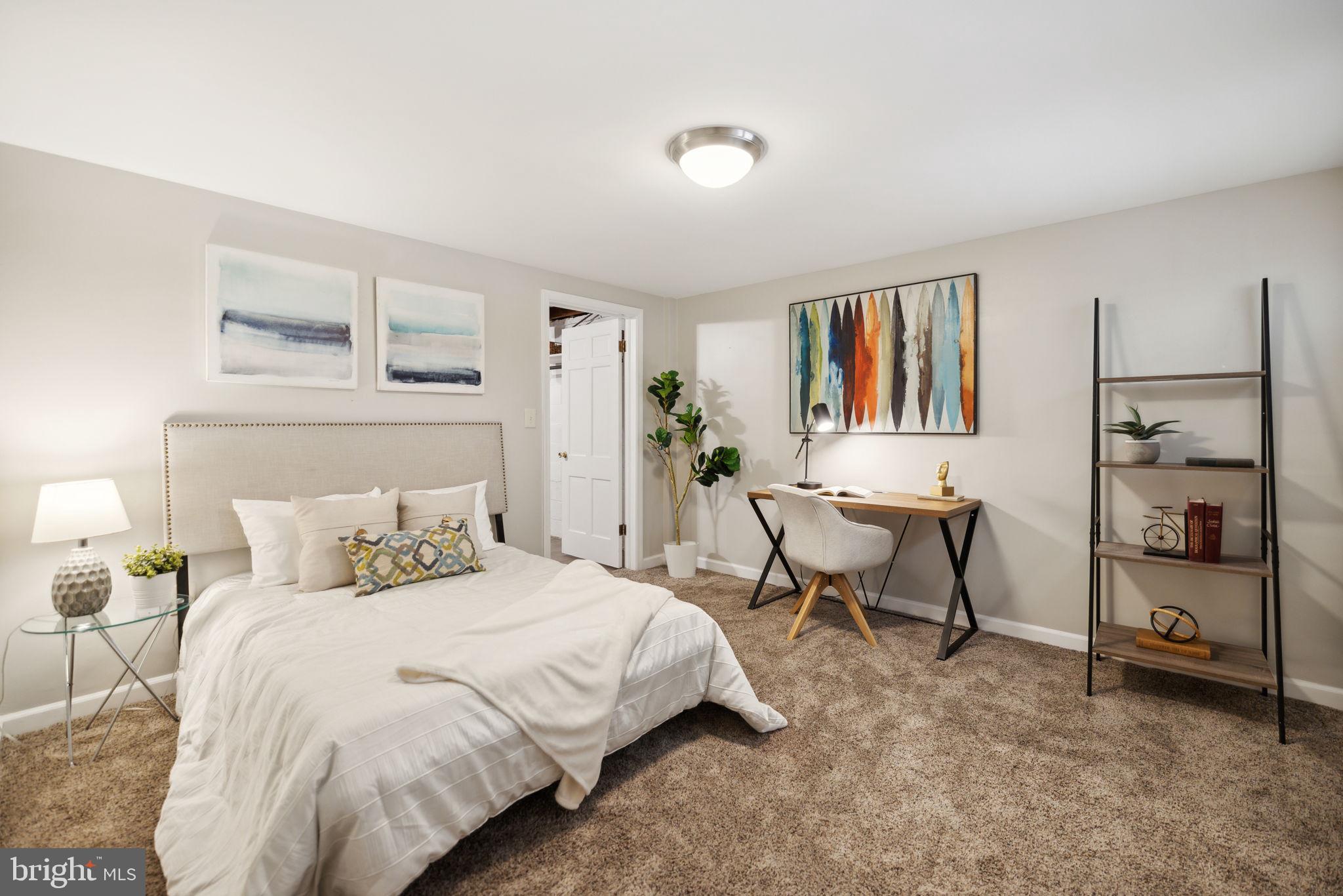 8012 Beech Tree Road Bethesda, MD 20817 - Photo 17 of 25 a bedroom with a bed and a desk