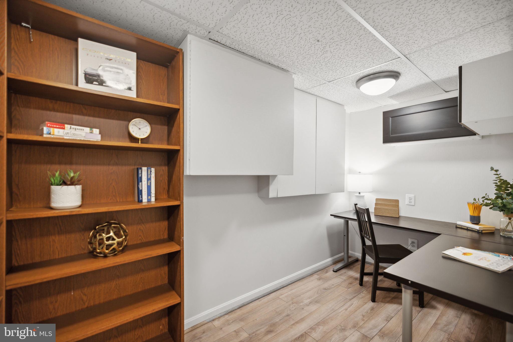 8012 Beech Tree Road Bethesda, MD 20817 - Photo 18 of 25 a view of a workspace with furniture and wooden floor