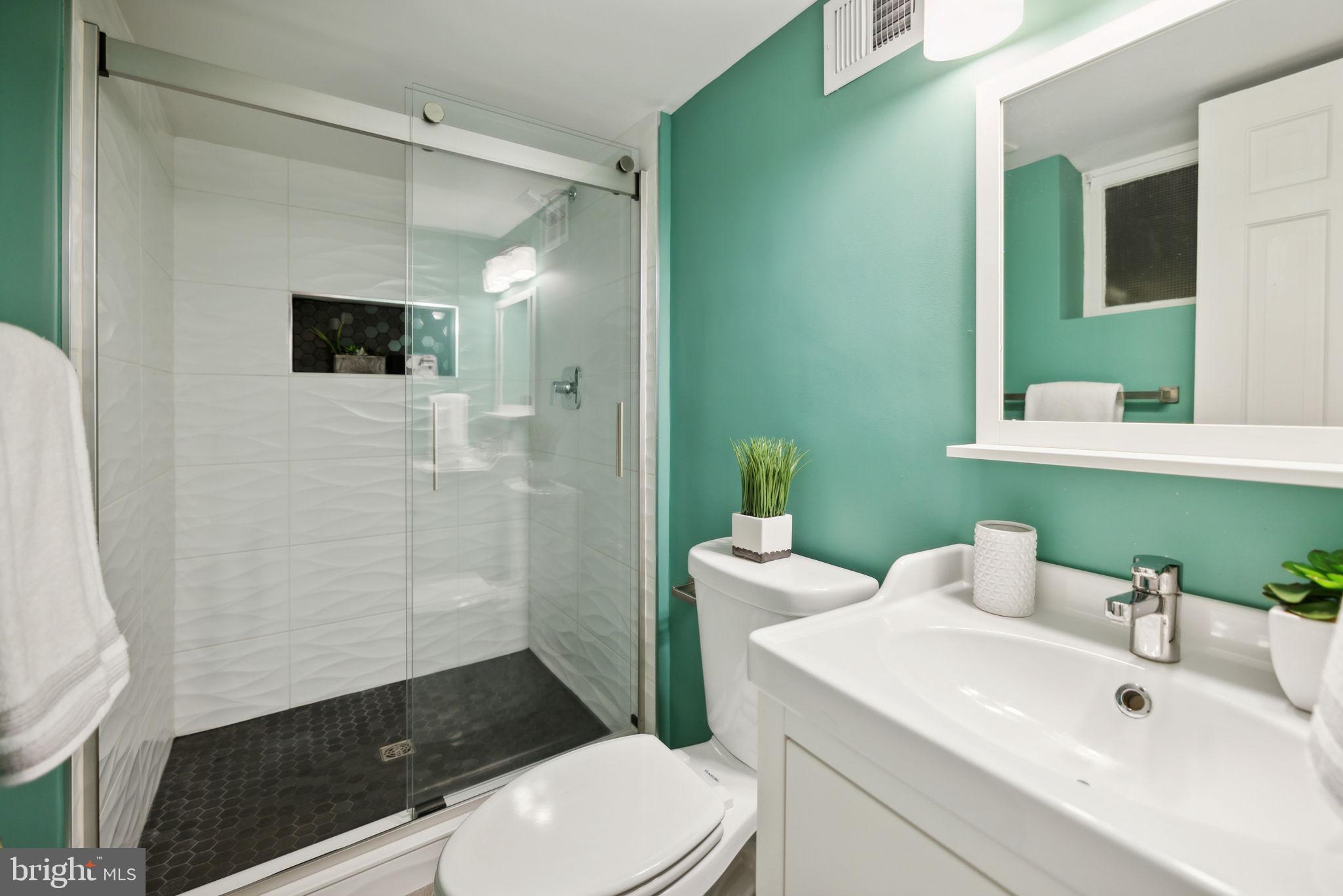 8012 Beech Tree Road Bethesda, MD 20817 - Photo 20 of 25 a bathroom with a sink a toilet and shower