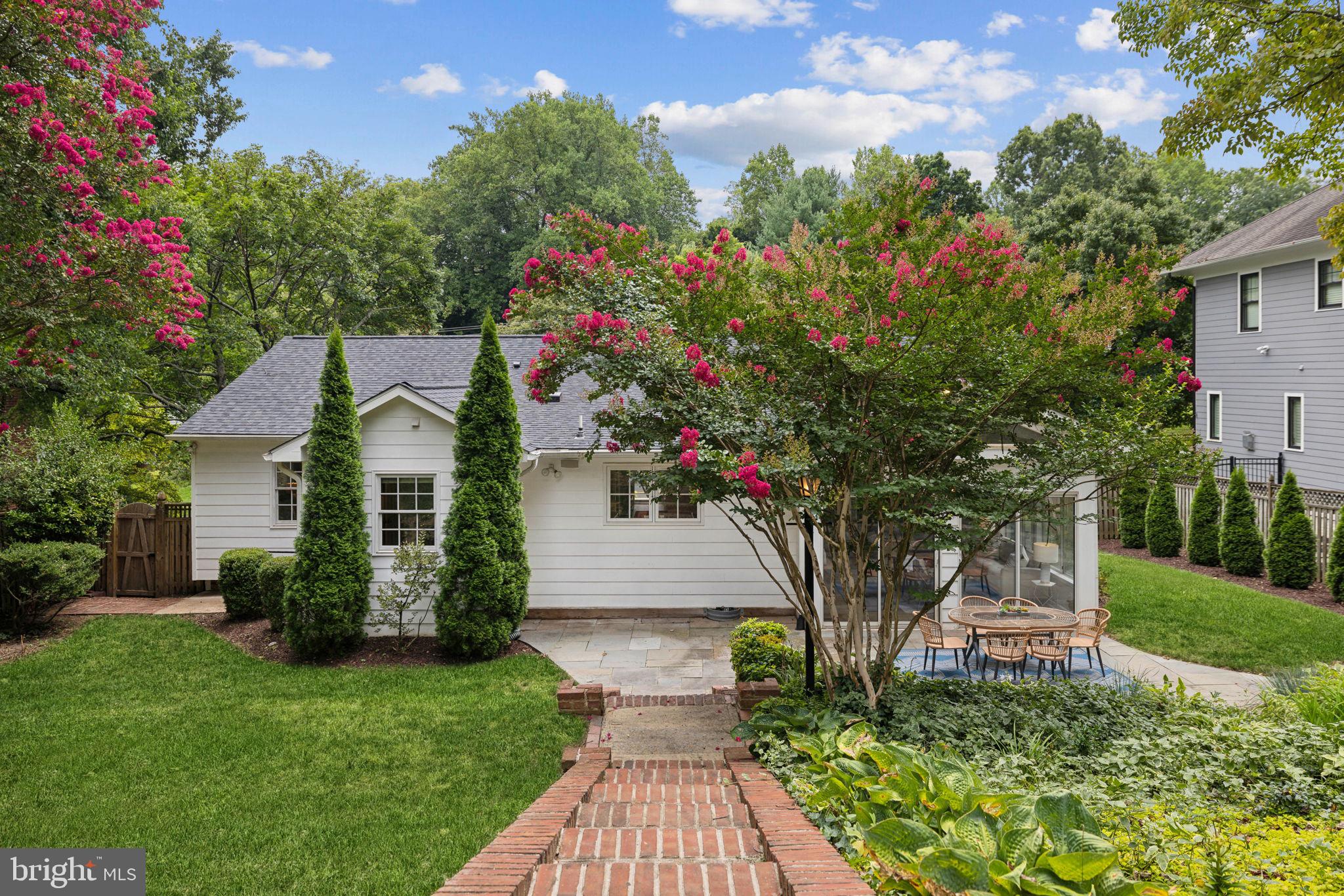 8012 Beech Tree Road Bethesda, MD 20817 - Photo 24 of 25 a front view of a house with garden