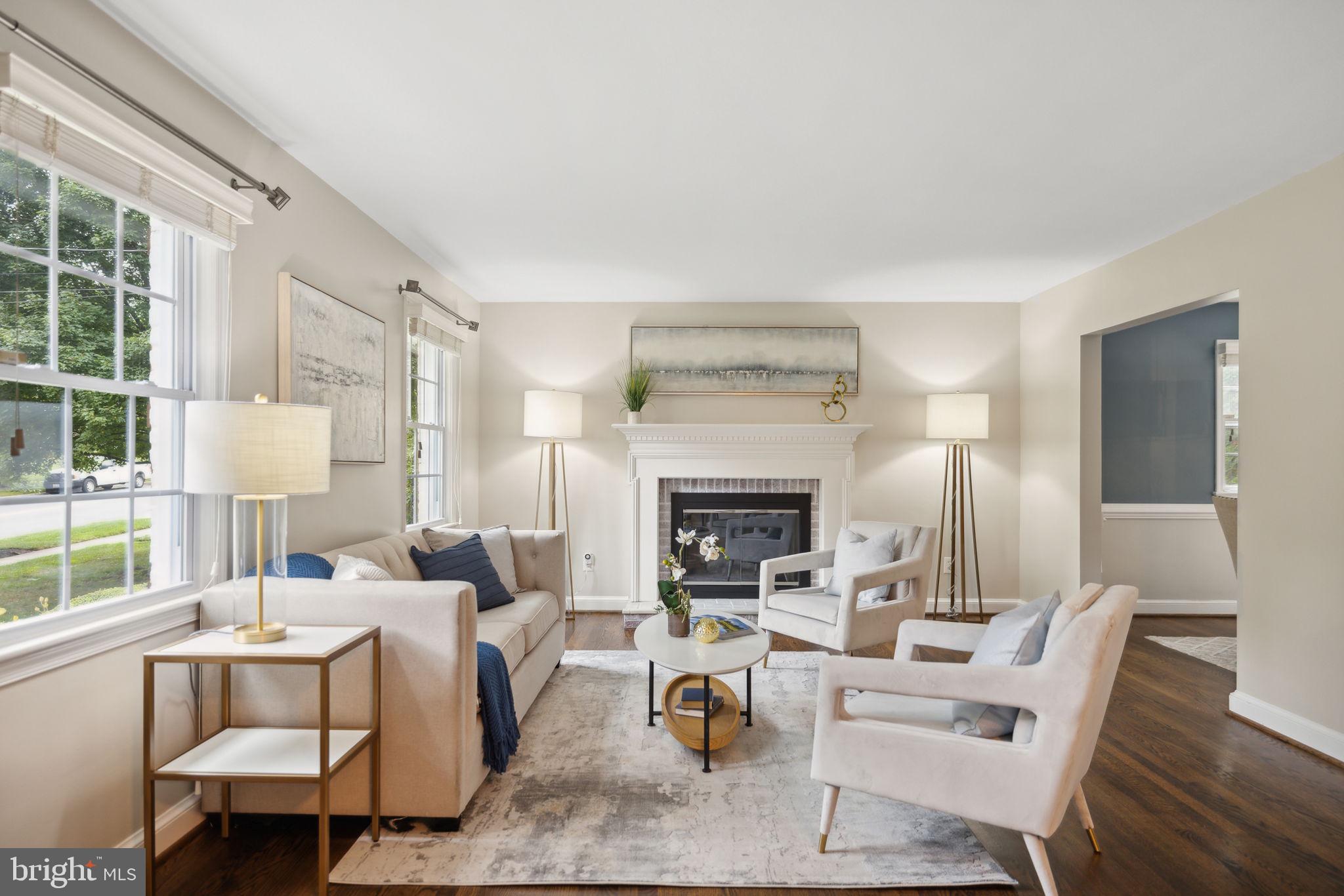 8012 Beech Tree Road Bethesda, MD 20817 - Photo 3 of 25 a living room with furniture and a fireplace