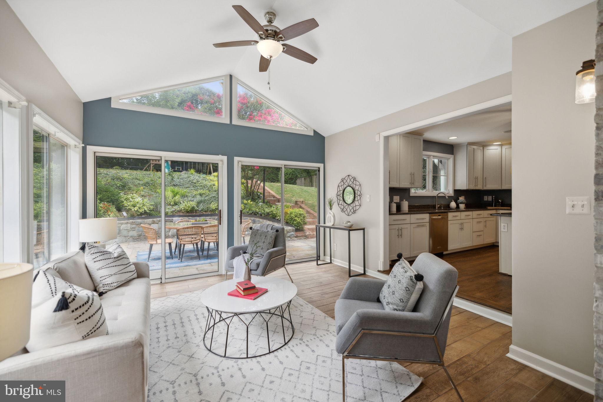 8012 Beech Tree Road Bethesda, MD 20817 - Photo 6 of 25 a living room with furniture and a large window