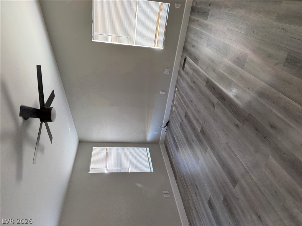 6041 Hafen Ranch Road Pahrump, NV 89061 - Photo 11 of 12 Natural light streams through high windows, illuminating the durable flooring in this versatile space.
