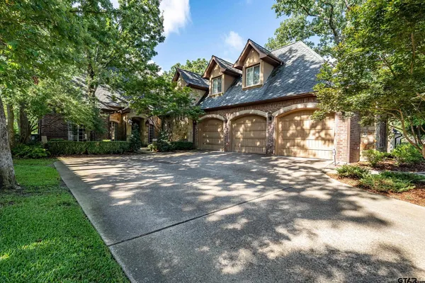 a view of a large house with a yard