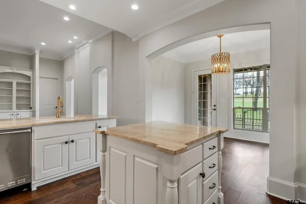 a view of a kitchen cabinets and a wooden floor
