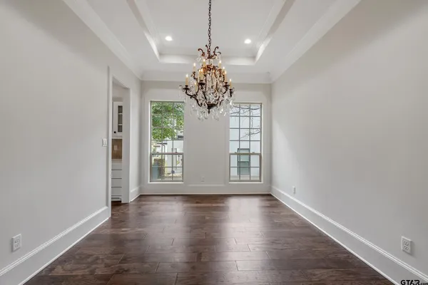 a view of a hallway with a chandelier