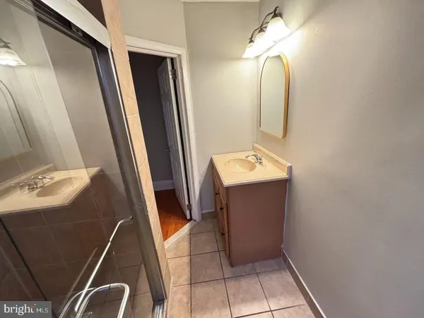 a bathroom with a sink and mirror
