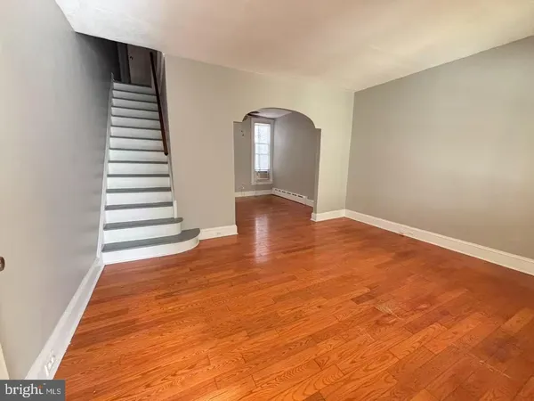 a view of an empty room with stairs