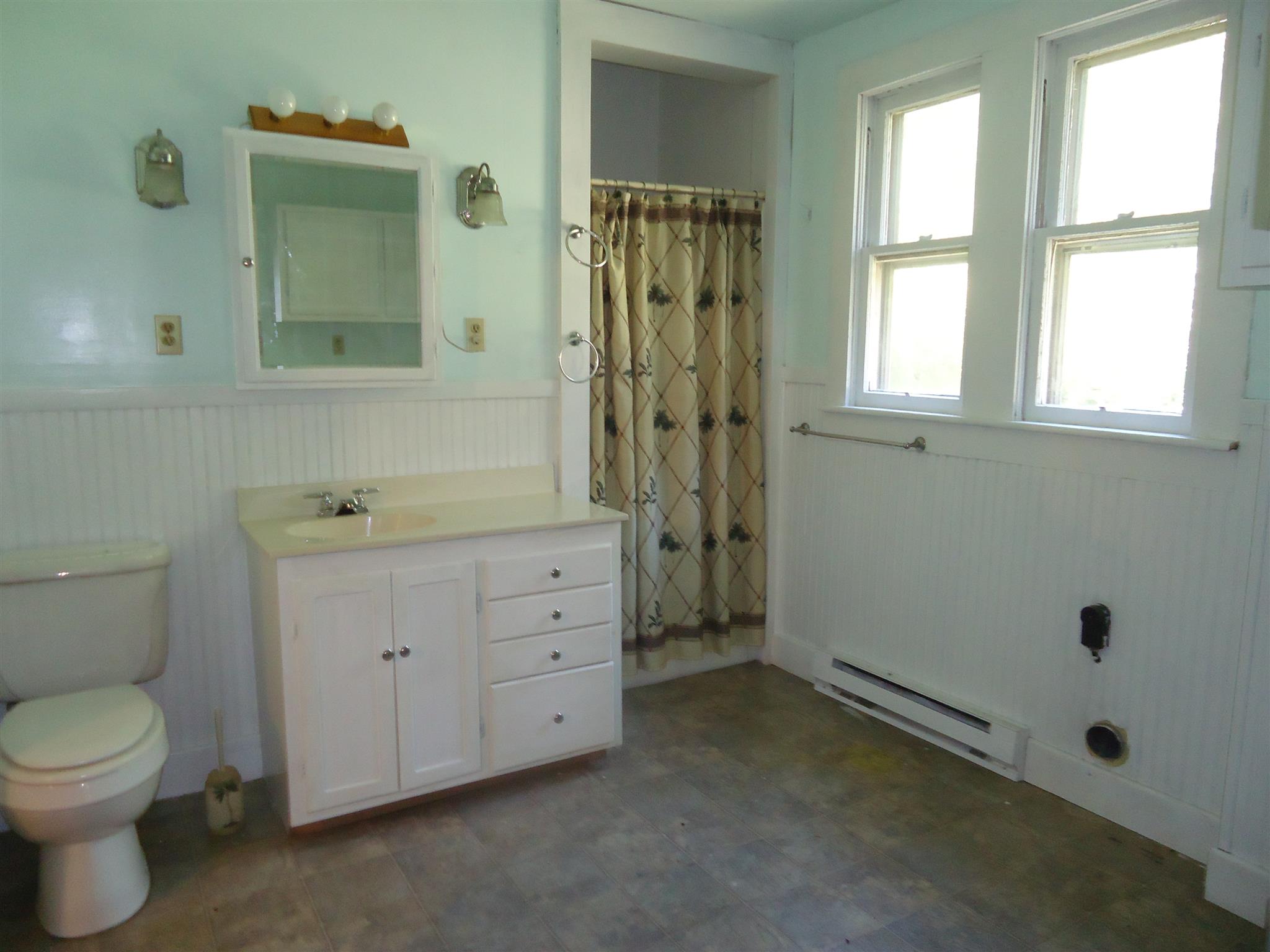 161 Bee Road Prospect, TN 38477 - Photo 17 of 19 a bathroom with a granite countertop toilet a sink a mirror and a window
